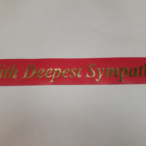 Red ribbon with gold "With Deepest Sympathy" text
