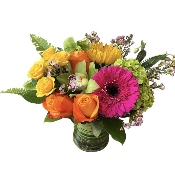 Mixed bouquet of roses, gerbera daisy, and hydrangea in a glass vase