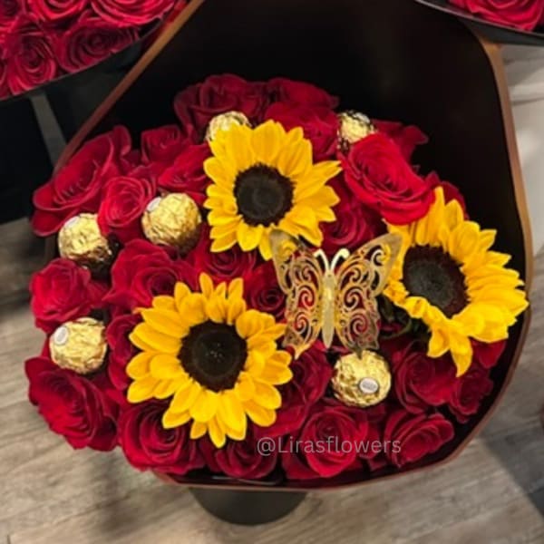 Bouquet of red roses with yellow sunflowers and gold chocolates in a black wrap