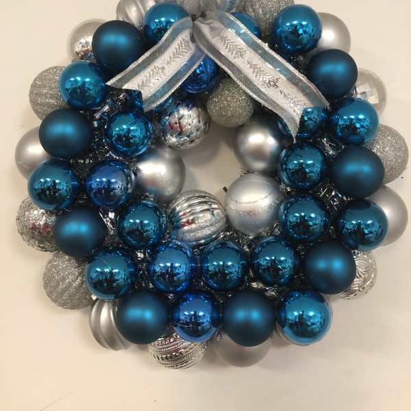 Blue and silver ornament wreath with a ribbon bow