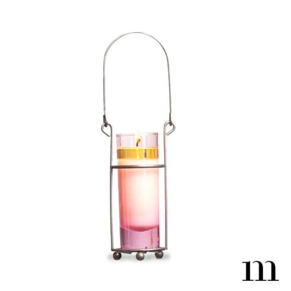 Pink candle in a metal hanging holder