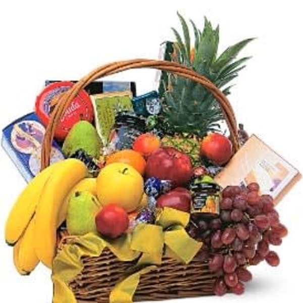 Fruit basket with bananas, apples, grapes, and packaged snacks