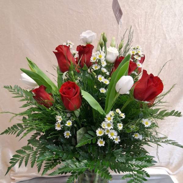 One dozen roses with white fillers