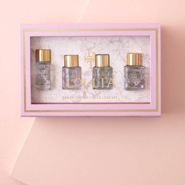 Pink gift box with four small perfume bottles inside