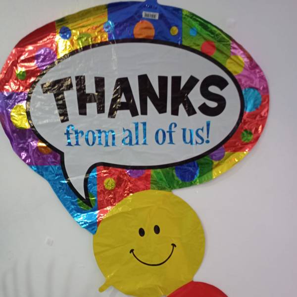 Colorful thank-you balloon with smiley faces
