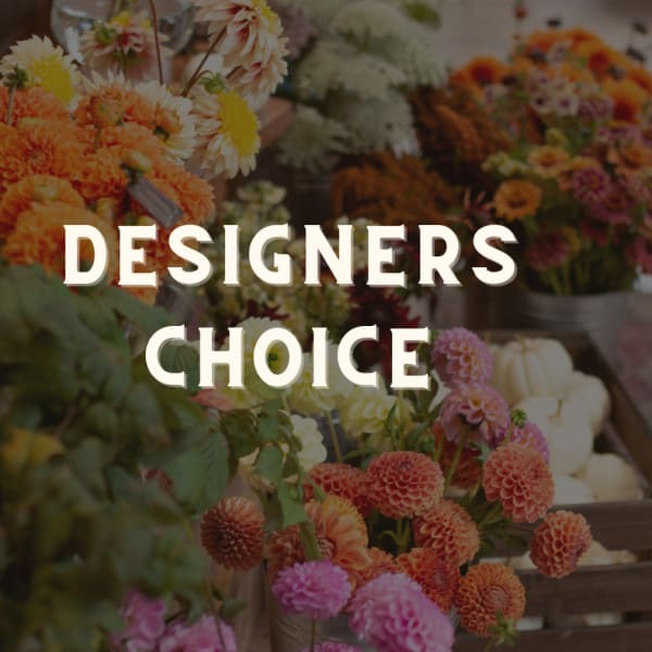 Designer’s choice floral display with orange, pink, and white blooms