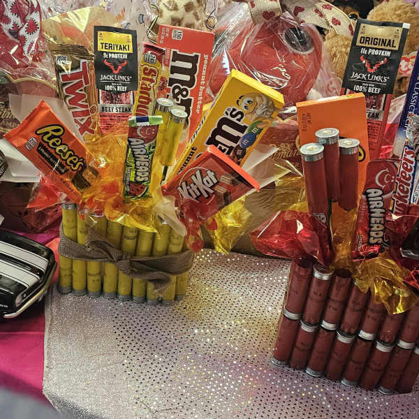 Gift bouquets made of candy bars and snack packs arranged in cellophane