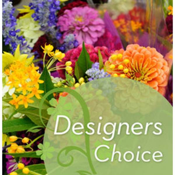 Mixed bouquet of colorful flowers with a "Designers Choice" label