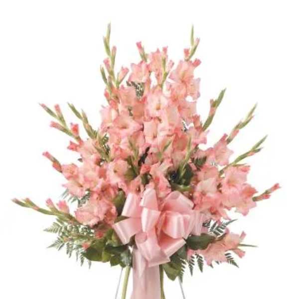 Pink gladiolus standing spray with a satin ribbon