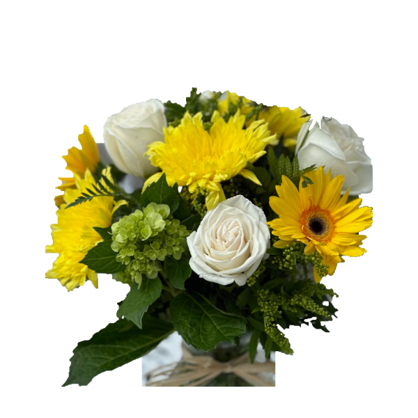 Yellow and white flower bouquet in a glass vase