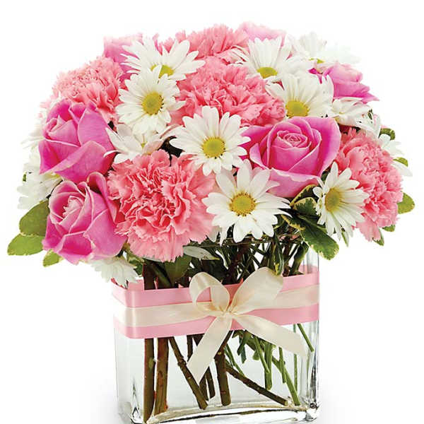 Pink roses and carnations with white daisies in a glass vase