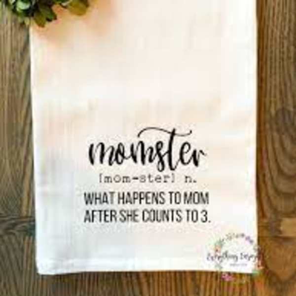 White towel with a floral wreath and "momster" text