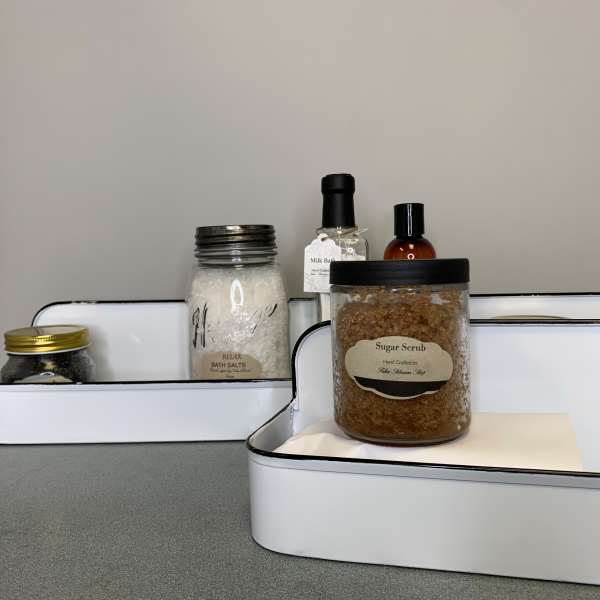 Gift trays with bath salts, sugar scrub, and bottles