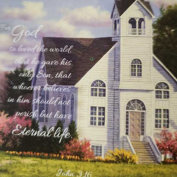 Church building with a Bible verse over a cloudy sky background