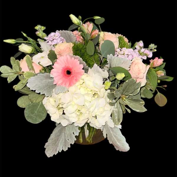 Mixed pastel bouquet with roses, hydrangea, and a pink gerbera daisy