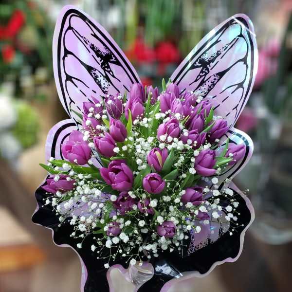 Purple tulip bouquet with white baby's breath and butterfly wings