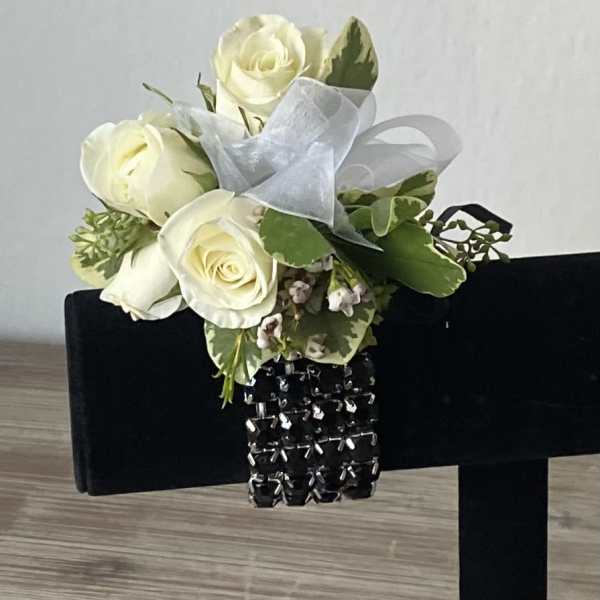 White rose bouquet with ribbon and black jeweled bracelet