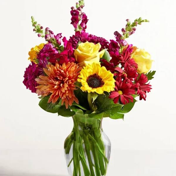 Colorful mixed bouquet in a clear glass vase