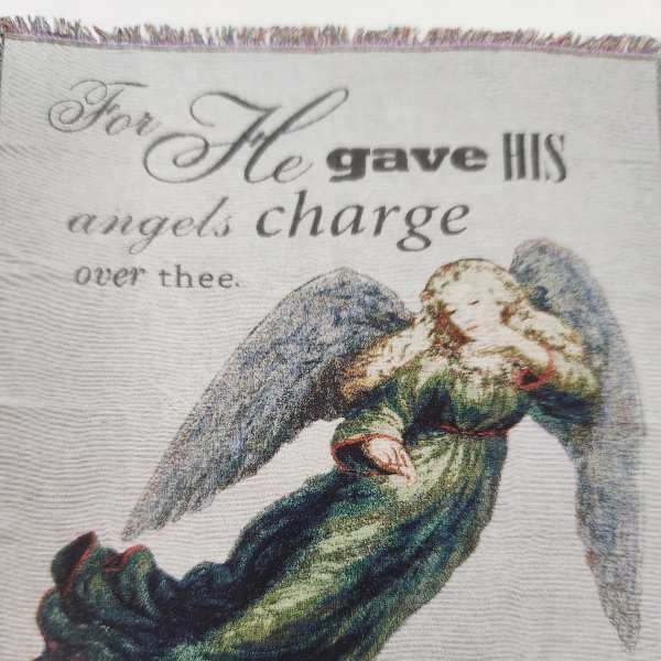Angel illustration with text on a fabric panel