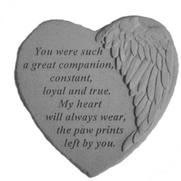 Heart-shaped memorial stone with engraved text and angel wing