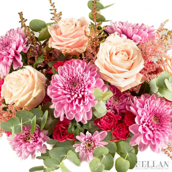 Arrangement of peach roses and pink chrysanthemums with small red blooms