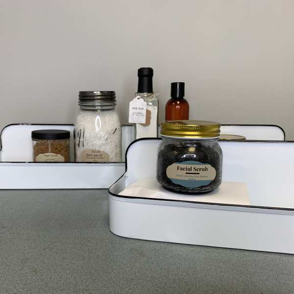 Gift trays with bath and body products in jars and bottles