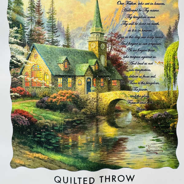 Quilted throw with a church scene and printed Lord's Prayer text
