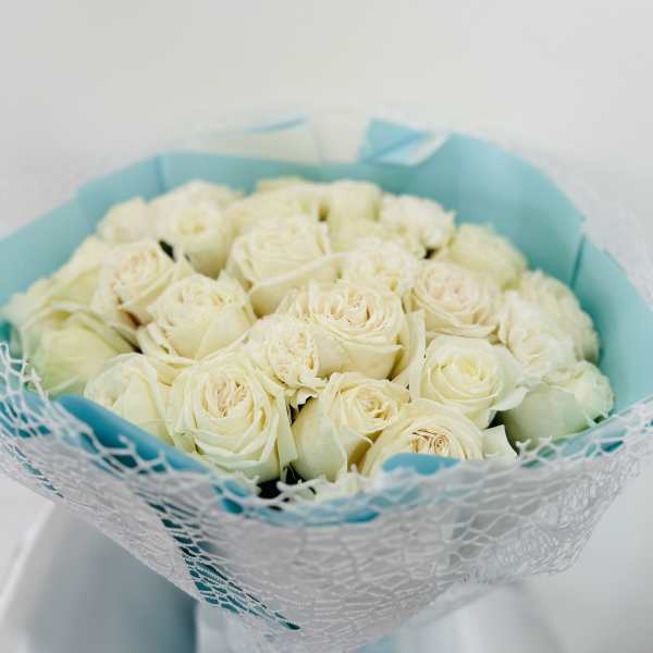 White roses with blue wrapping
