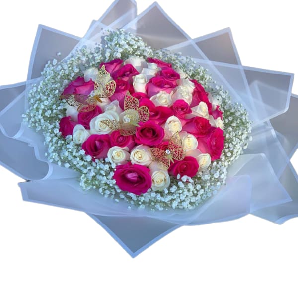 Bouquet of pink and white roses with baby’s breath and butterfly accents
