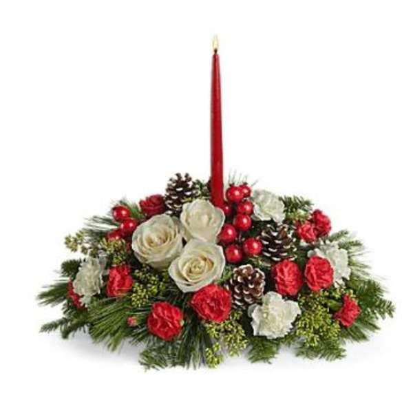 Holiday centerpiece with red candle, white roses, pinecones, and red accents