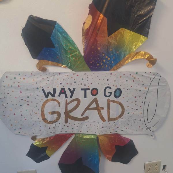 Rainbow graduation balloon with "Way to Go Grad" text