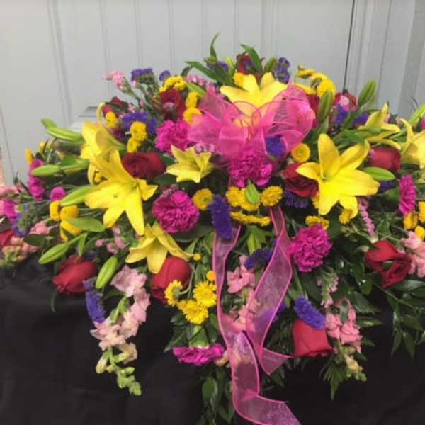 shining-light-casket-spray