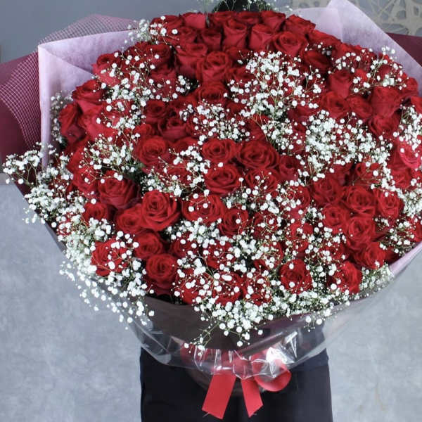 Large bouquet of red roses with white baby's breath