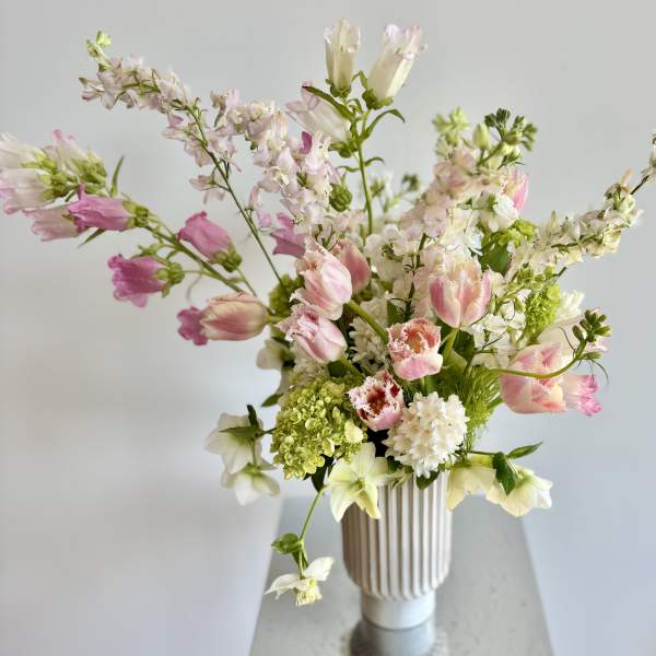Pink and white mixed bouquet in a ribbed vase