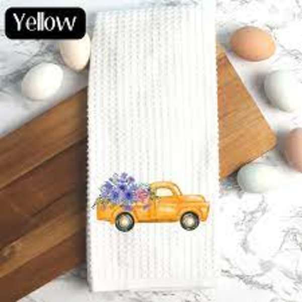 White ribbed towel with a yellow flower truck graphic and painted eggs