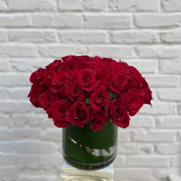 Red rose bouquet in a glass vase