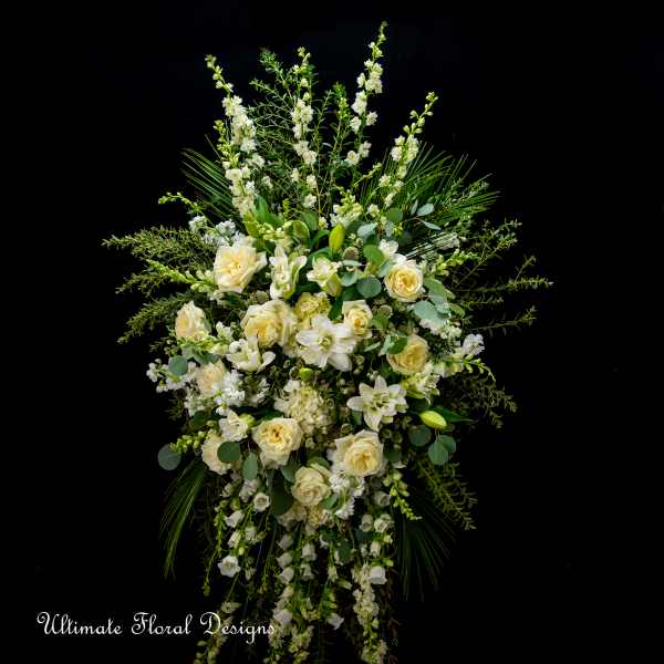 Tall white and cream floral standing spray with roses and lilies
