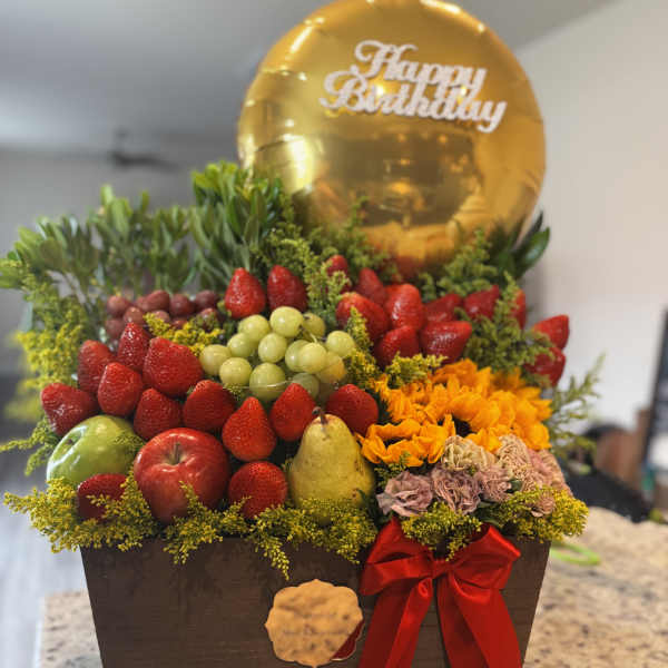 Fruit gift box with flowers and a gold Happy Birthday balloon
