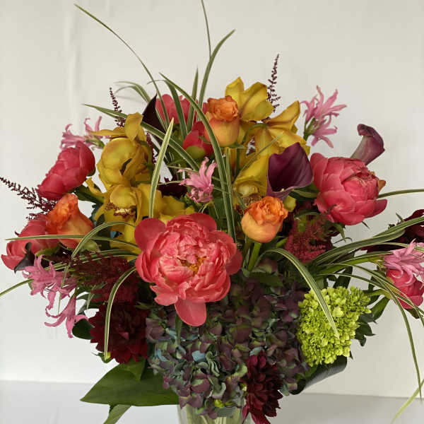 Colorful mixed bouquet in a clear glass vase