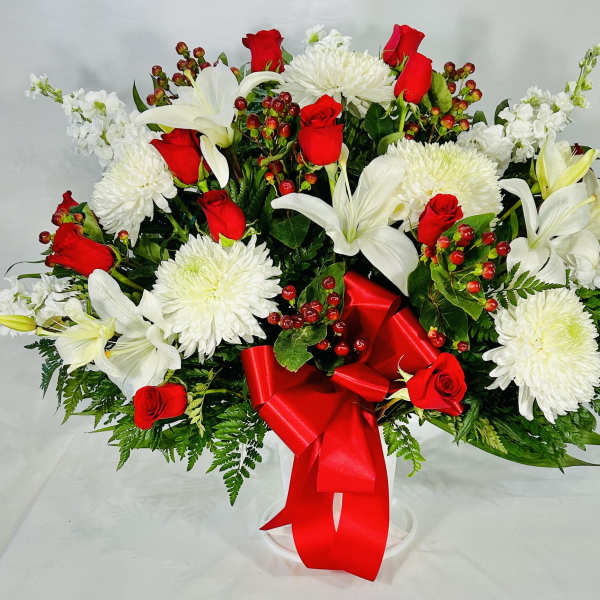 Bouquet of red roses and white lilies with a red ribbon