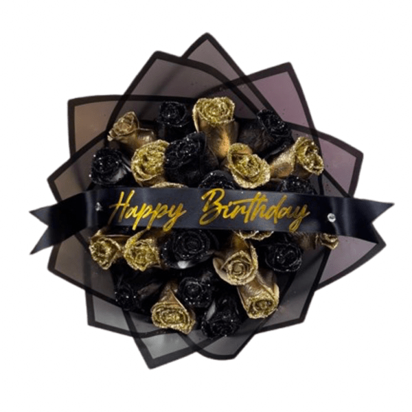 Bouquet of black and gold roses wrapped in dark paper with a Happy Birthday ribbon