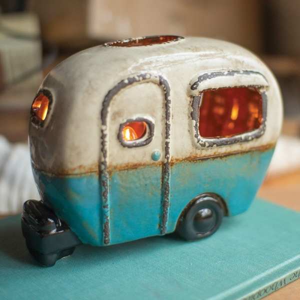 Ceramic camper-shaped candle holder with glowing openings
