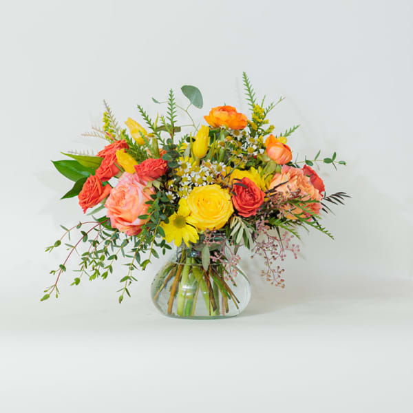 Colorful mixed bouquet in a clear glass vase