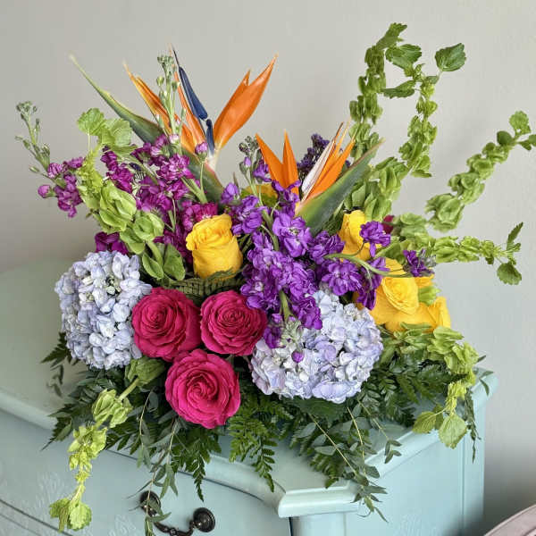 Bright mixed bouquet with roses, hydrangeas, and bird of paradise