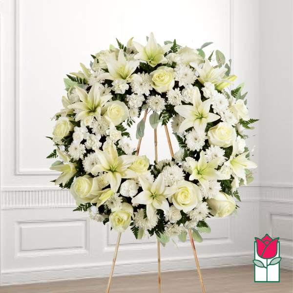 White floral wreath on a standing easel