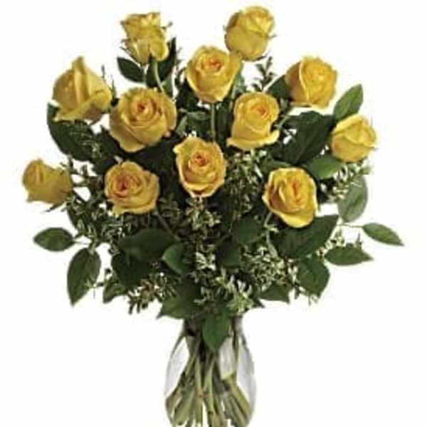Bouquet of yellow roses in a clear glass vase