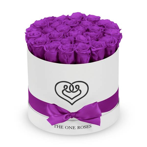 Round box of purple roses with a satin ribbon