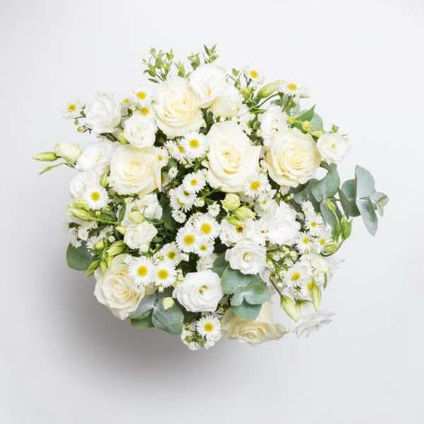 White rose bouquet with small daisy-like flowers and eucalyptus