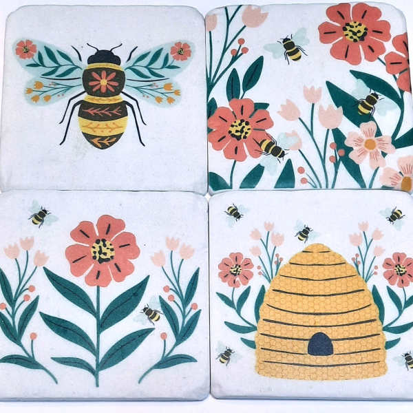 Set of four bee and flower coasters with a beehive design