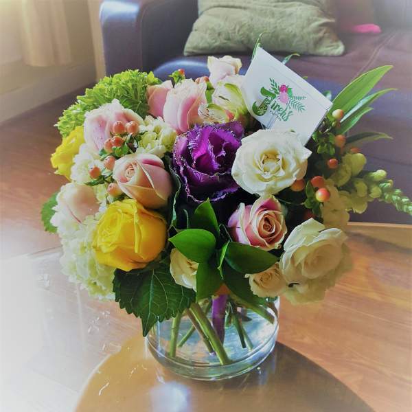 Bouquet of mixed roses in a glass vase